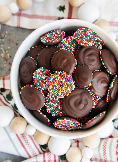 Chocolate Nonpareils in a small white bowl.