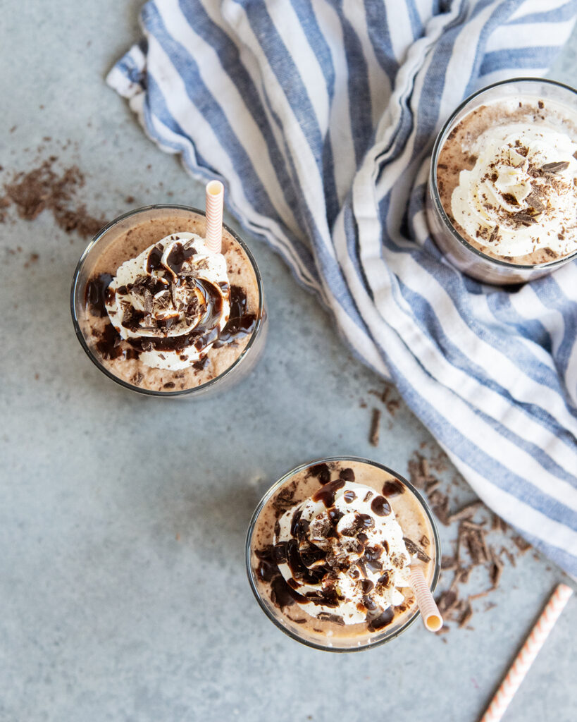 An above view of three glasses of frozen hot chocolate.