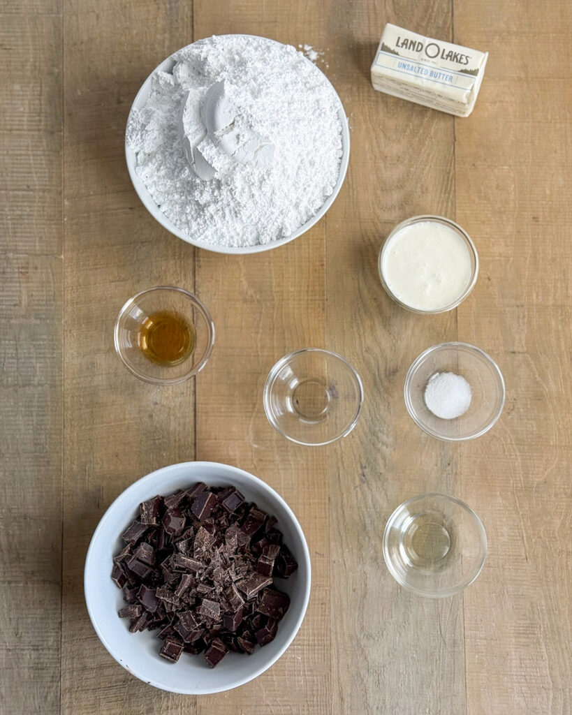 The ingredients needed to make buttercream candies in small bowls.