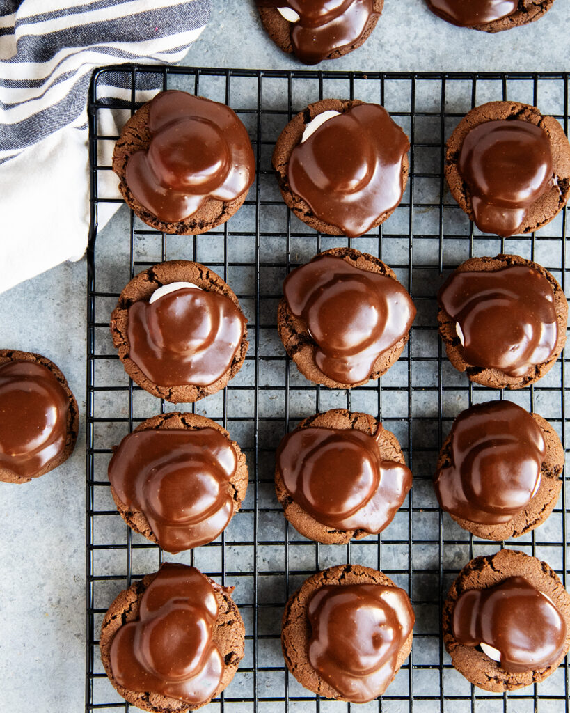 An above view of chocolate marshmallow cookies, showing the chocolate ganache on top.