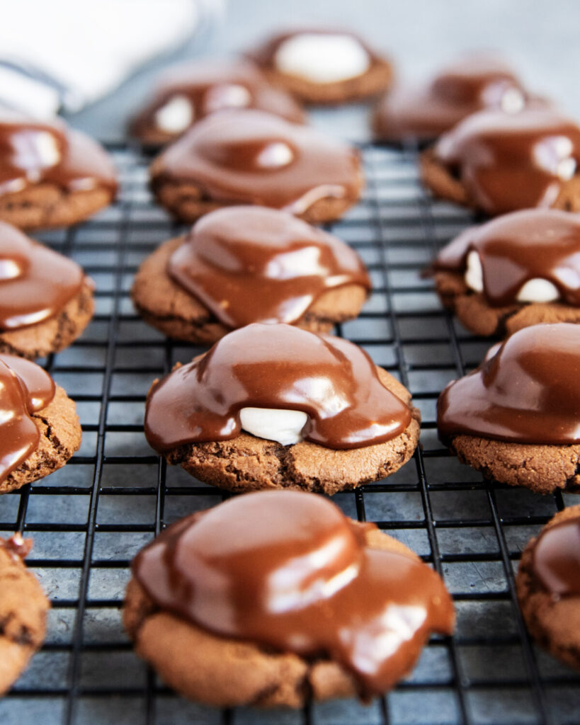 Rows of chocolate marshmallow cookies topped with chocolate ganache.