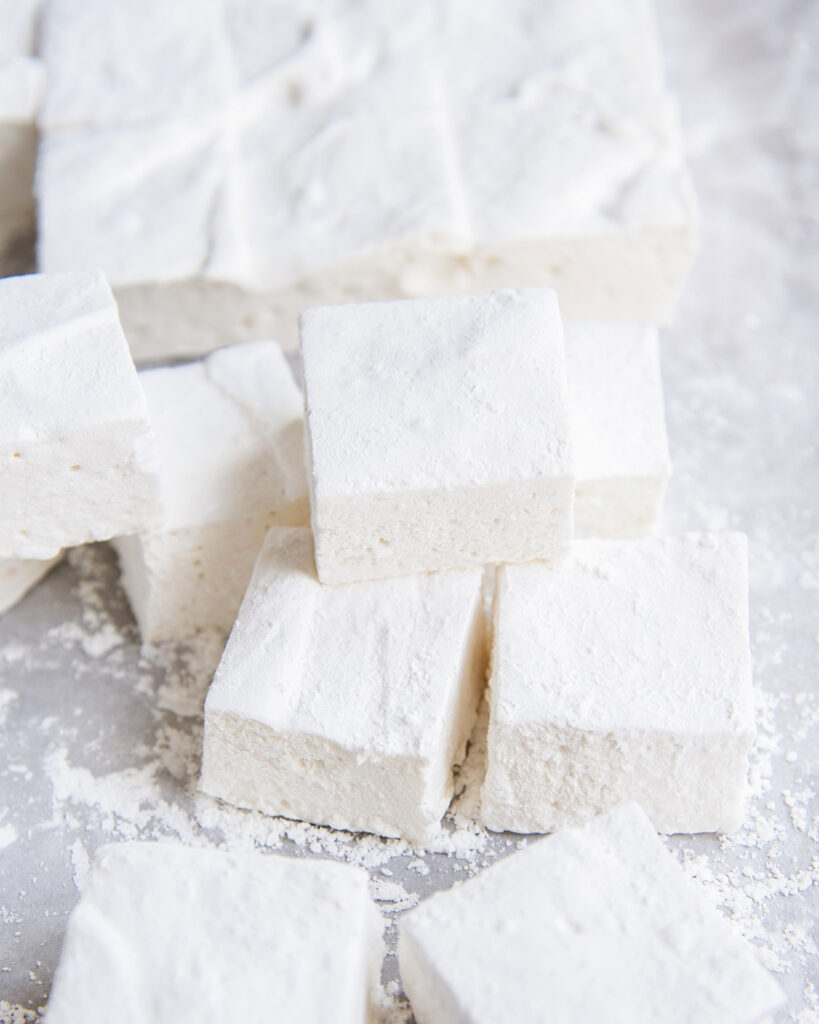 A pile of square white marshmallows.