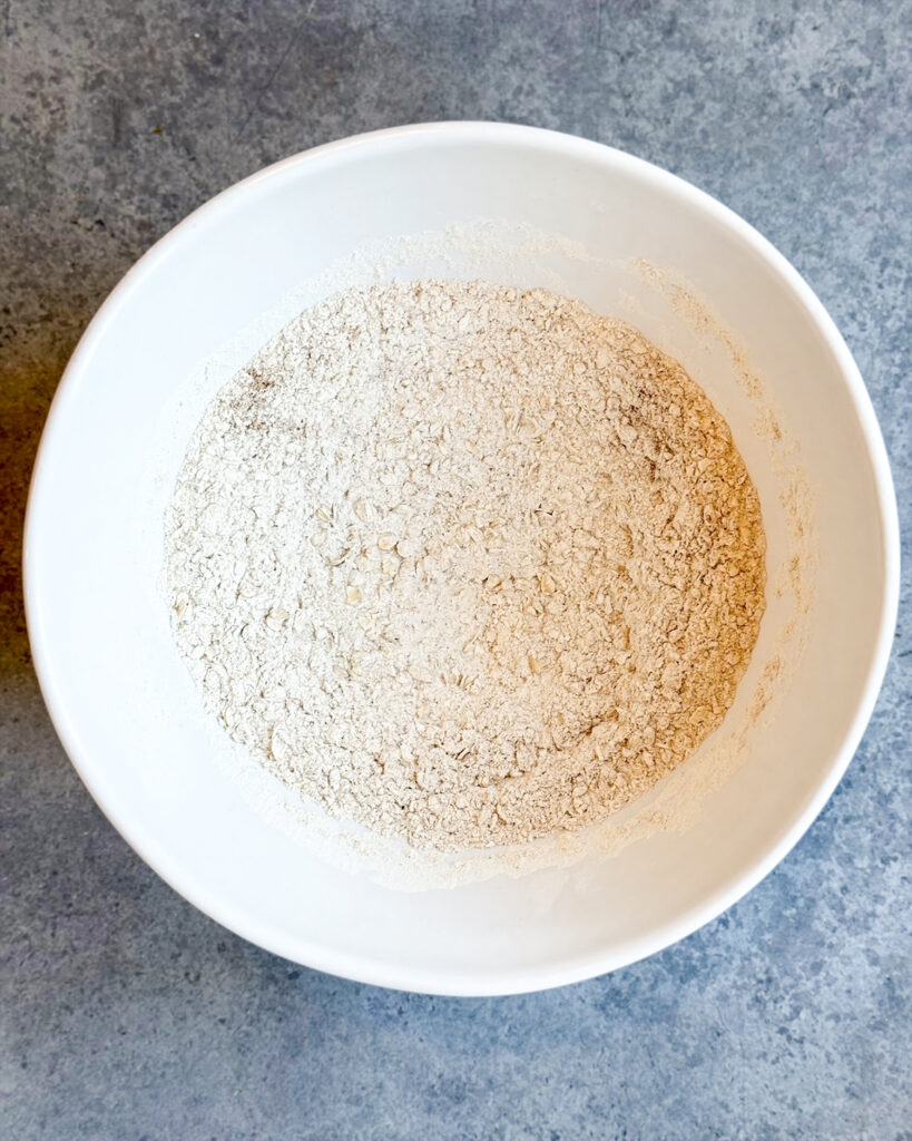 Dry cookie dough ingredients in a bowl.
