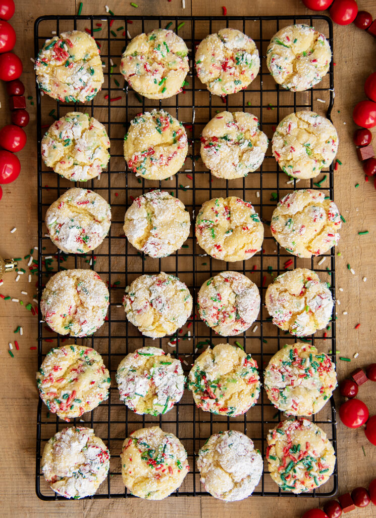 An above view of rows of gooey butter cookies on a wire cooling rack.
