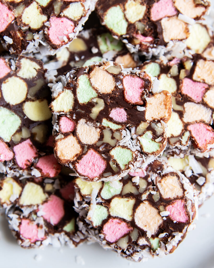 A pile of Church Windows on a plate, with chocolate rounds filled with colorful mini marshmallows.