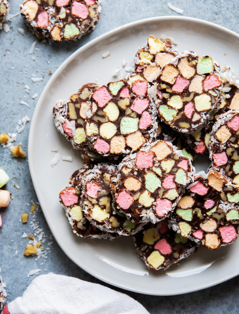 A pile of Church Windows on a plate, with chocolate rounds filled with colorful mini marshmallows.