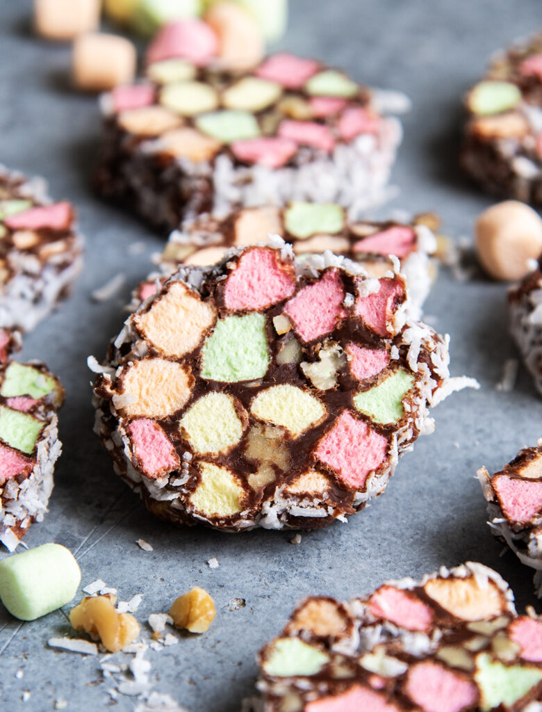 A Church Window candy filled with colorful mini marshmallows, and walnuts coated in chocolate and coconut.