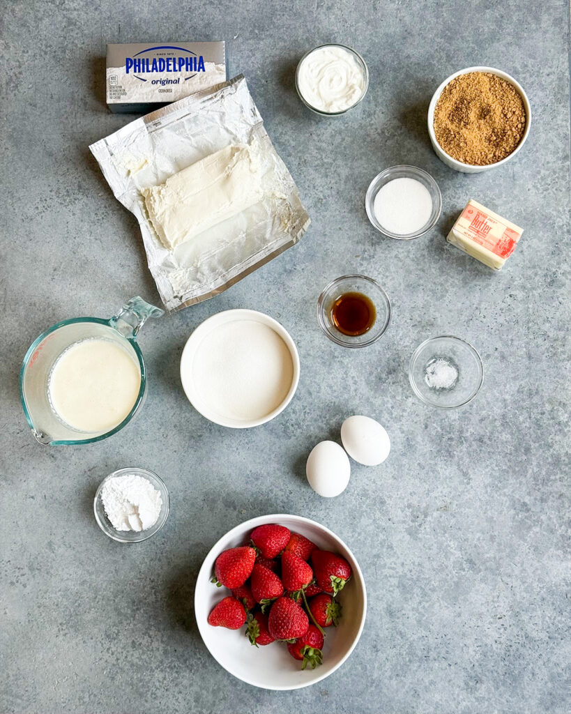 The ingredients needed to make santa hat cheesecakt bites. 