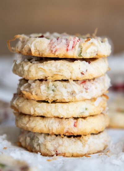 A stack of Santa's whiskers cookies coated in golden coconut.