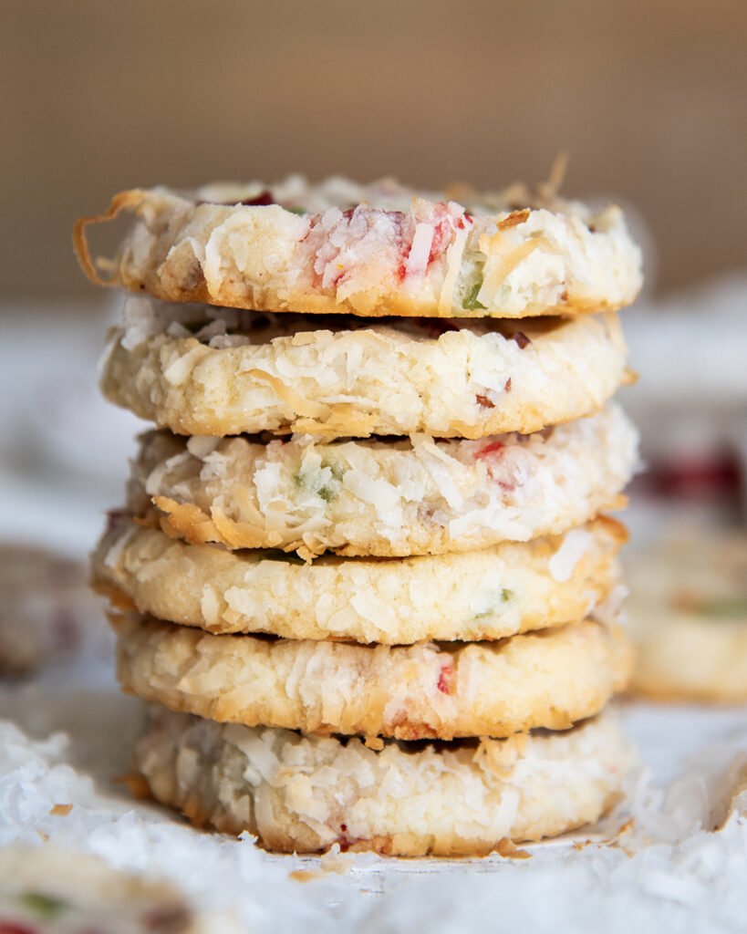 A stack of Santa's whiskers cookies coated in golden coconut.