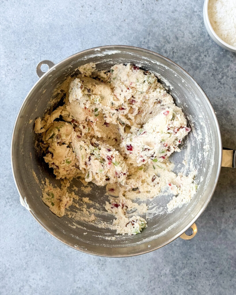 Shortbread cookie dough filled with candied cherries and pecans.