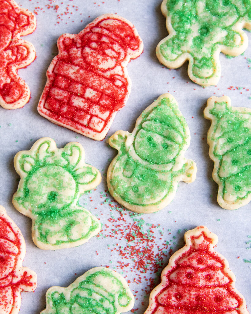 An above view of christmas sugar topped shortbread cookies, decorated with red and green sugar.