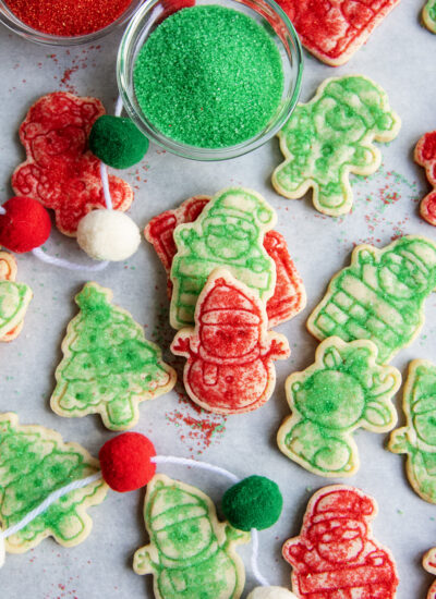 An above view of christmas sugar topped shortbread cookies, decorated with red and green sugar.