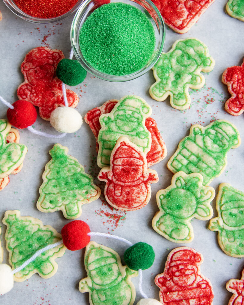 An above view of christmas sugar topped shortbread cookies, decorated with red and green sugar.