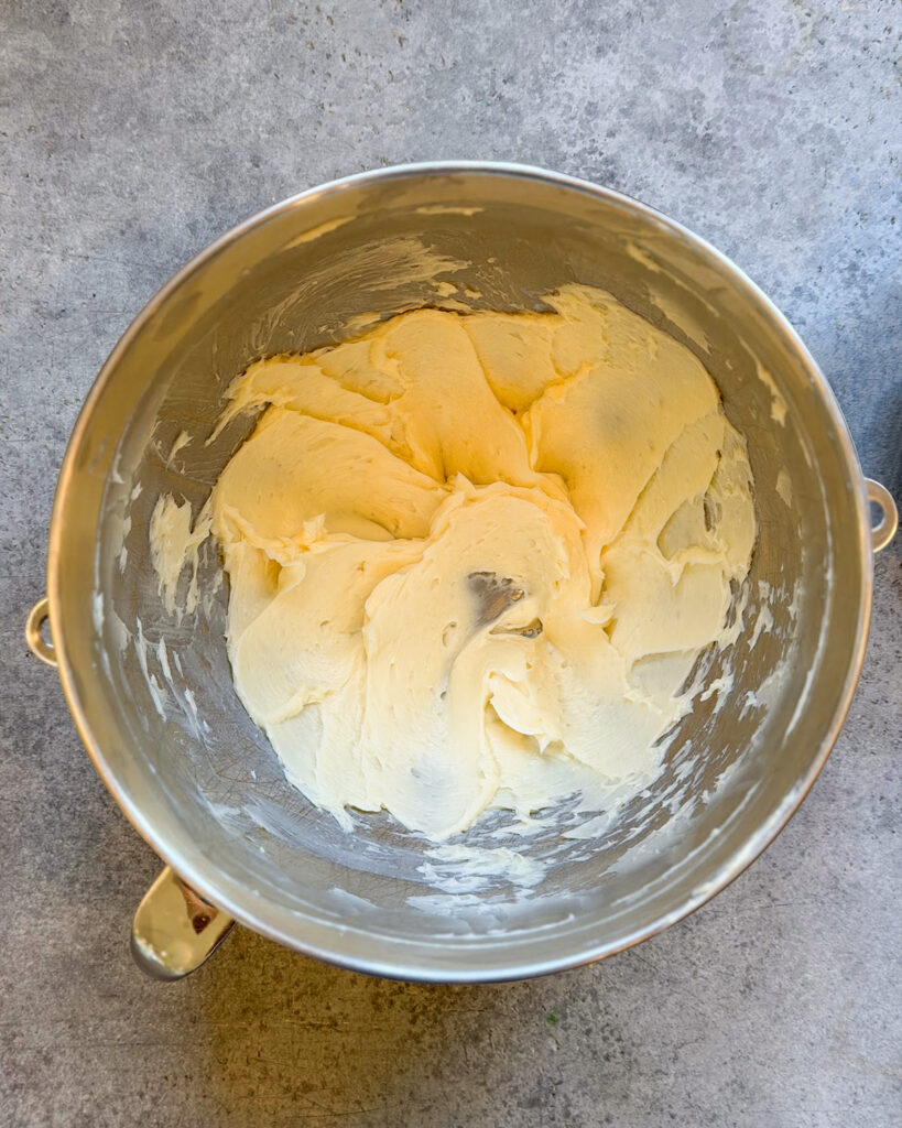 A bowl of creamed butter and sugar.