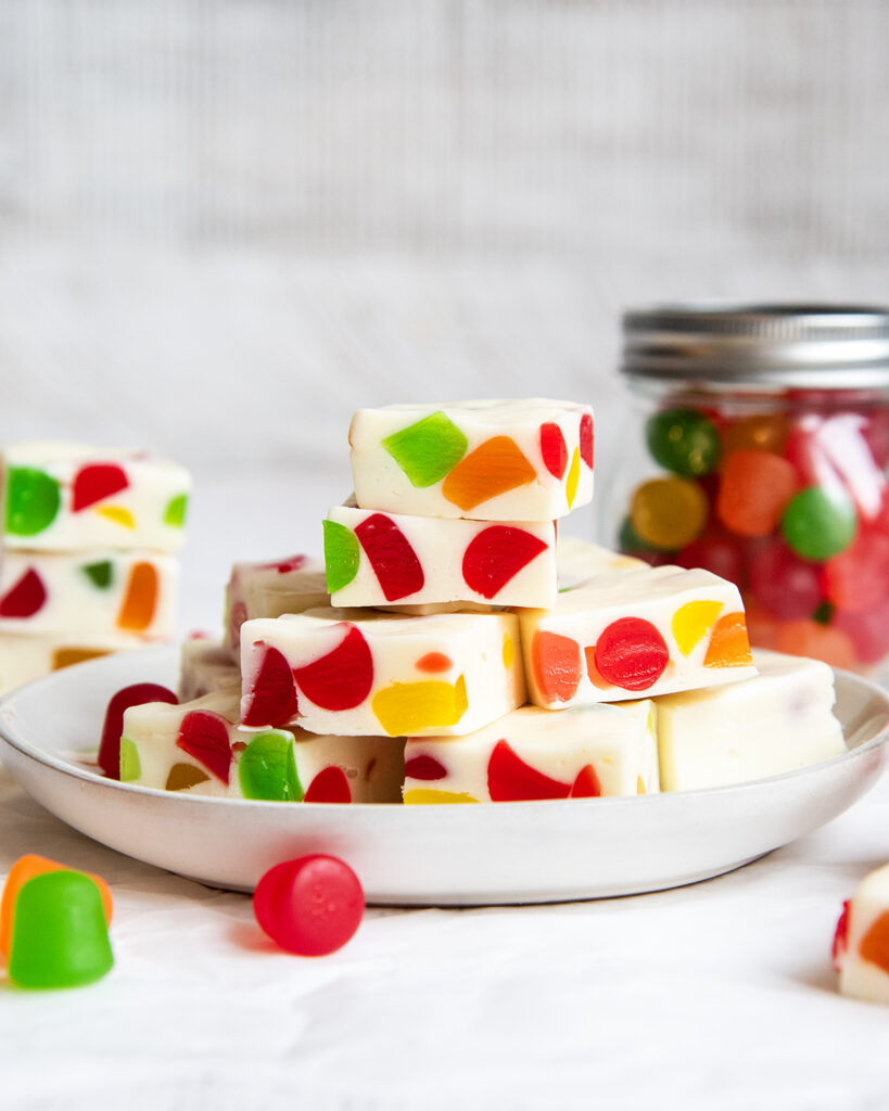 A pile of gumdrop nougat candy on a plate.