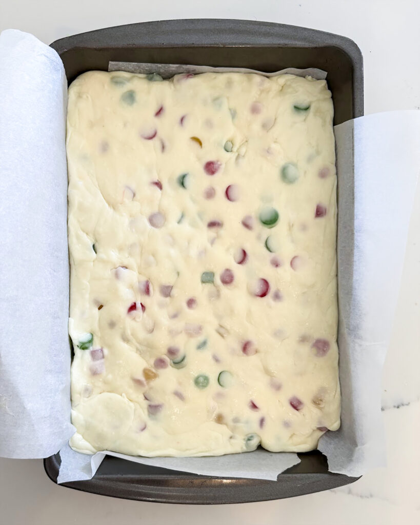 An above view of gumdrop nougat in a metal pan.