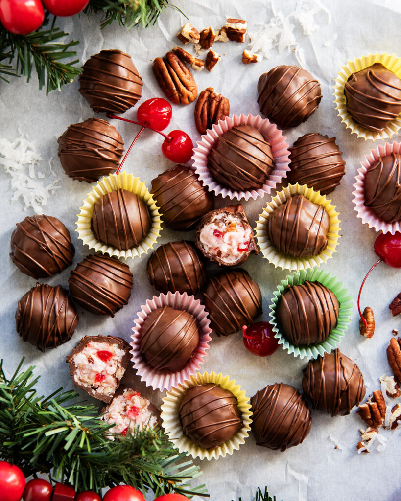 An above view of martha washington candies, some are cut open showing the filling in the middle.