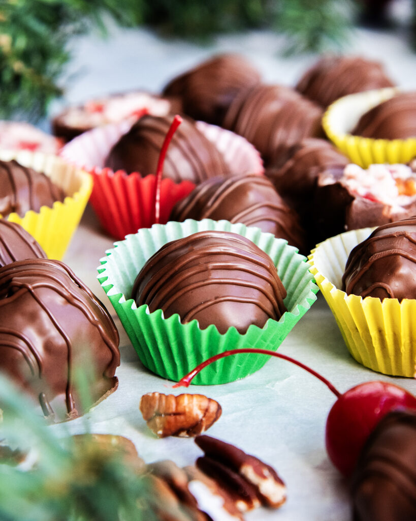 A chocolate candy ball in a green wrapper.