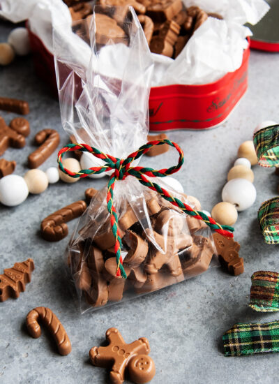 A bag of peanut butter meltaways next to a tin of them.