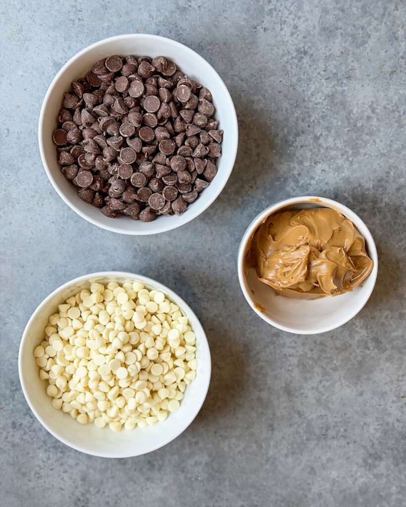 The ingredients needed to make peanut butter meltaways in small bowls. 