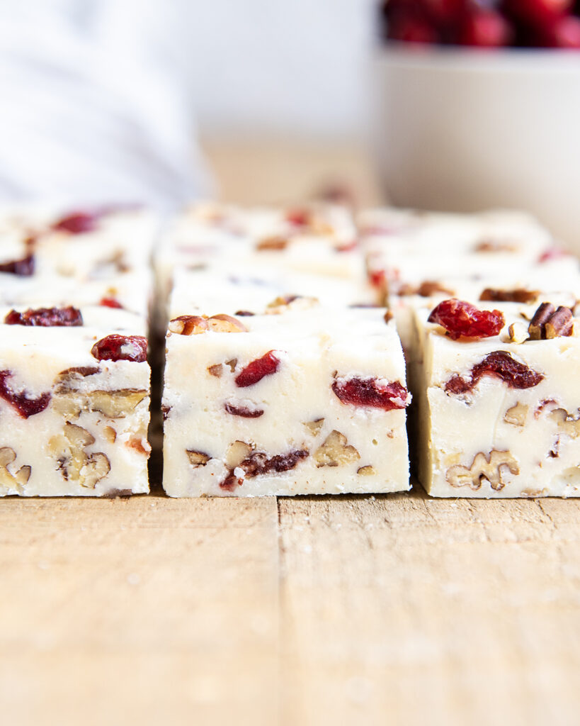 Rows of white chocolate cranberry and pecan fudge.