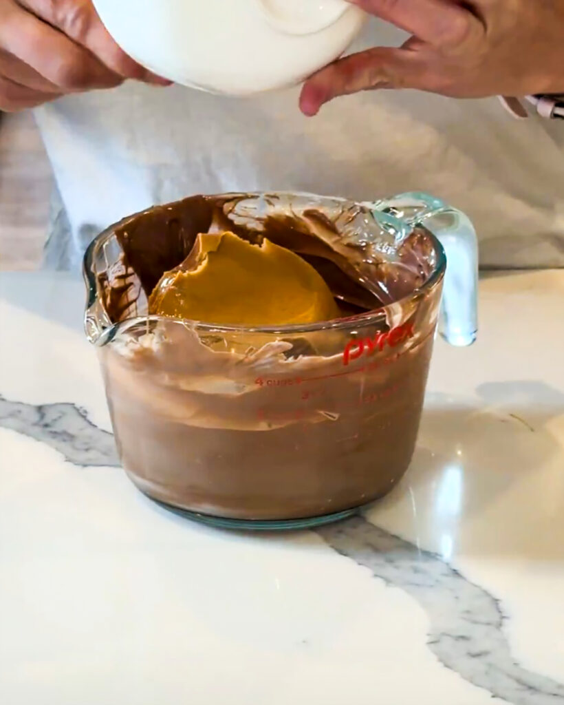 Melted chocolate topped with creamy peanut butter.