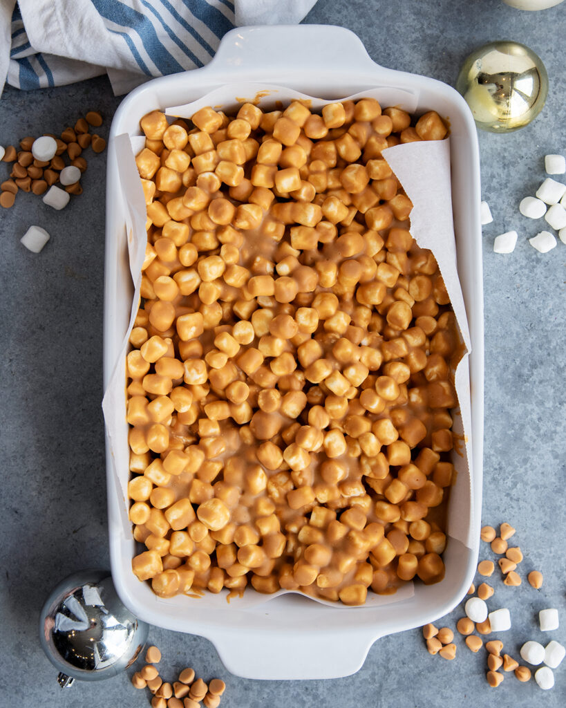 An above view of butterscotch marshmallow bars in a pan.