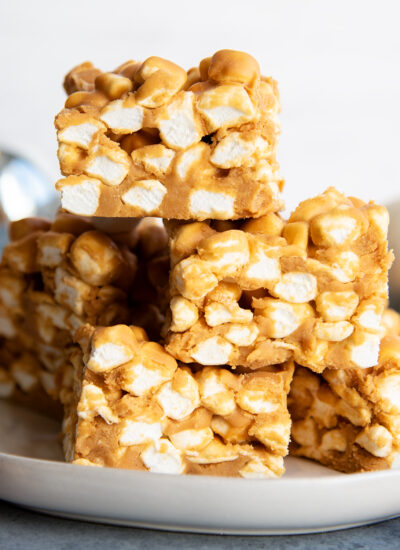 A pile of butterscotch peanut butter marshmallow squares.