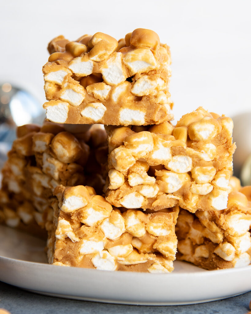 A pile of butterscotch peanut butter marshmallow squares.
