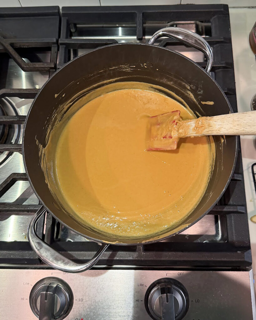 Melted peanut butter and butterscotch in a pot.