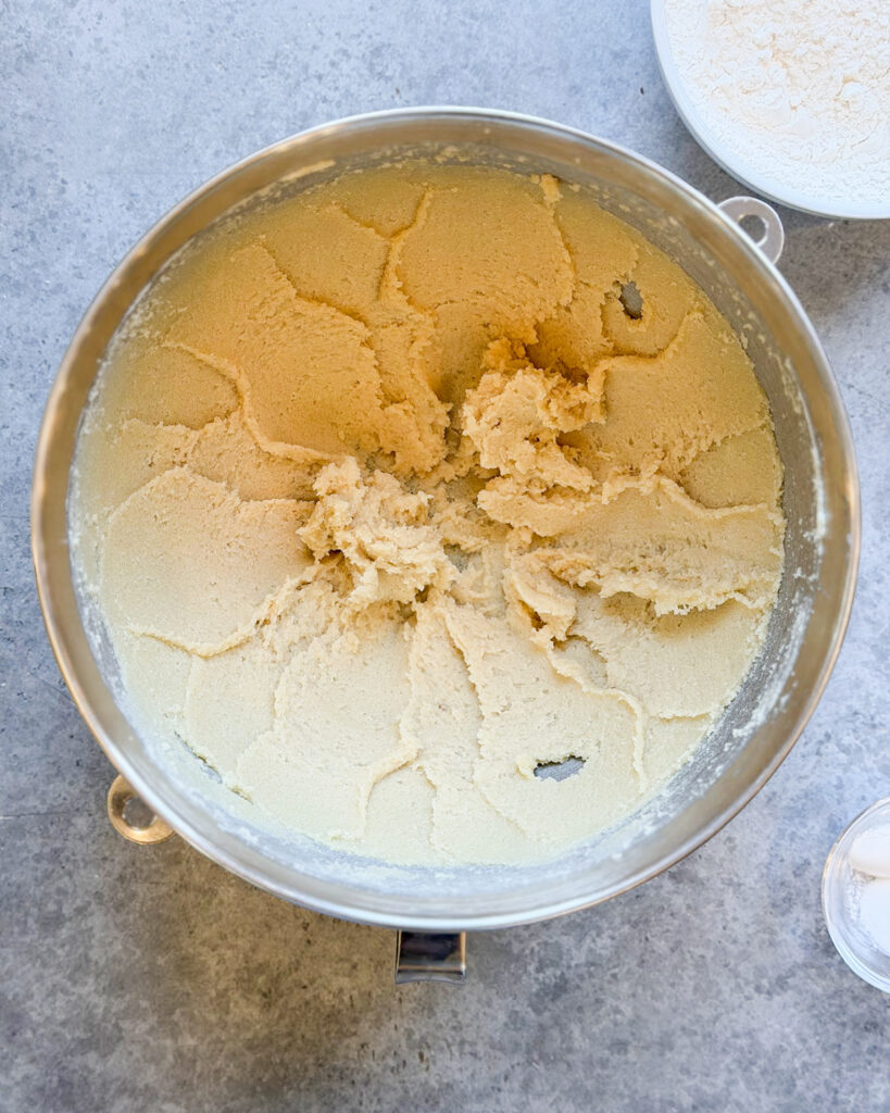 A bowl of creamed butter and sugar.