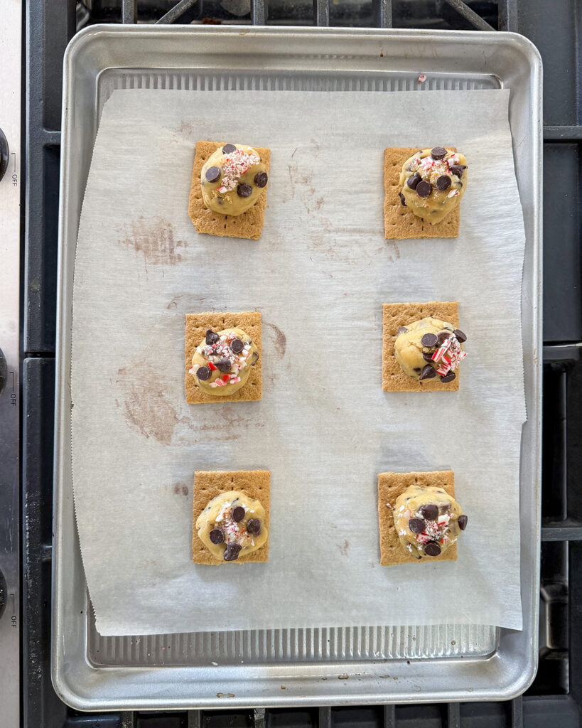 Peppermint smore cookie dough in balls on graham crackers.