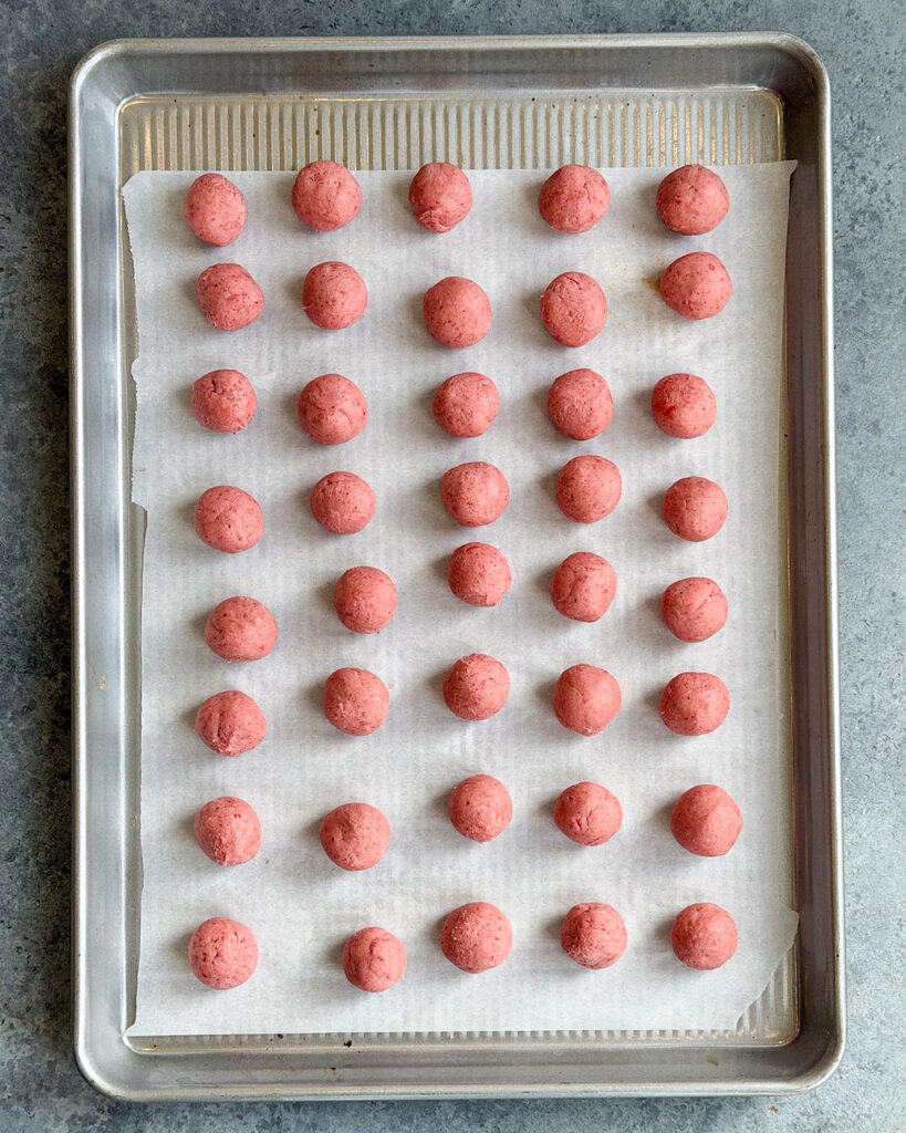 The pink insides of strawberry buttercream candies.
