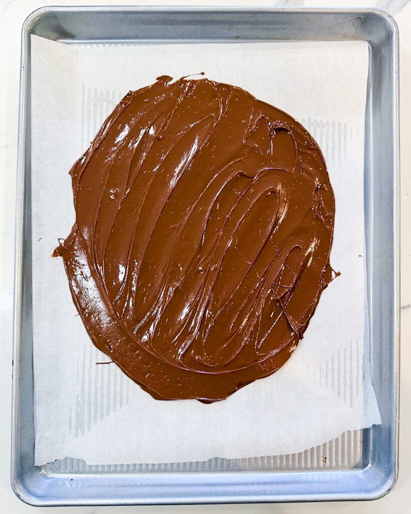 Chocolate spread on a piece of parchment paper.