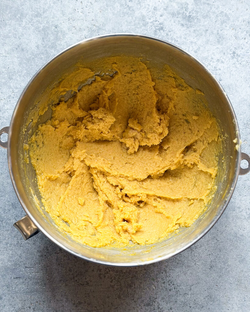 Creamed butter and eggs in a bowl.