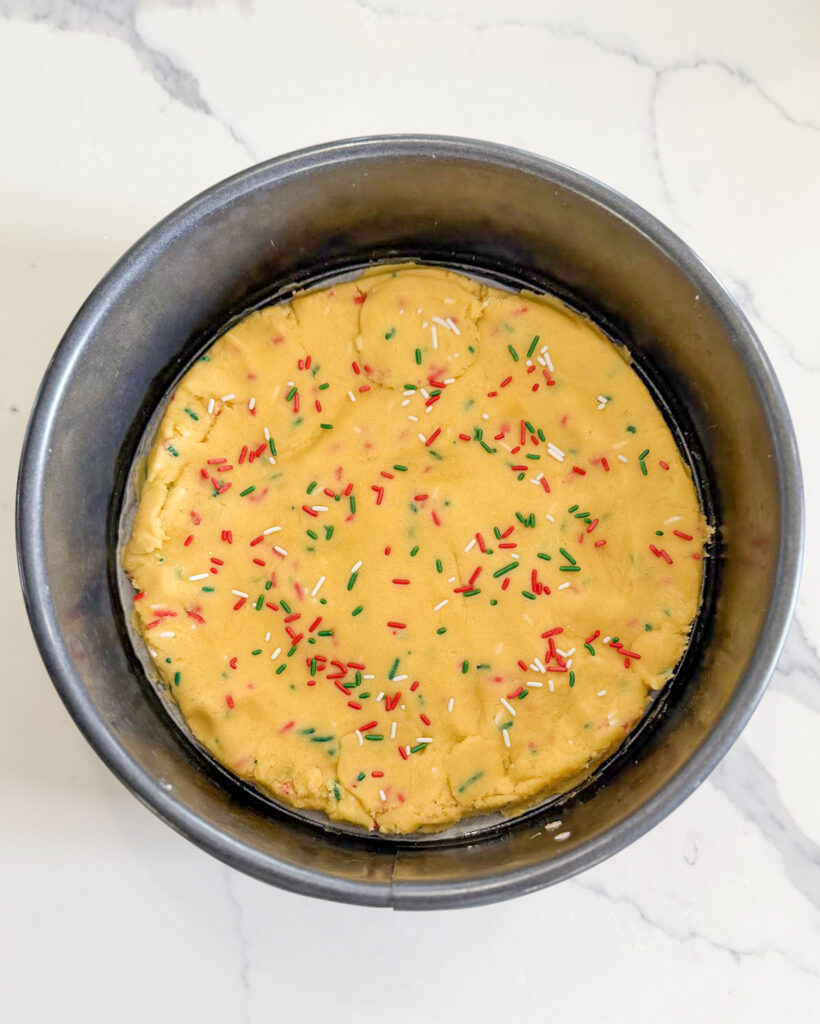 Christmas cookie dough pressed into a 9inch cake pan.