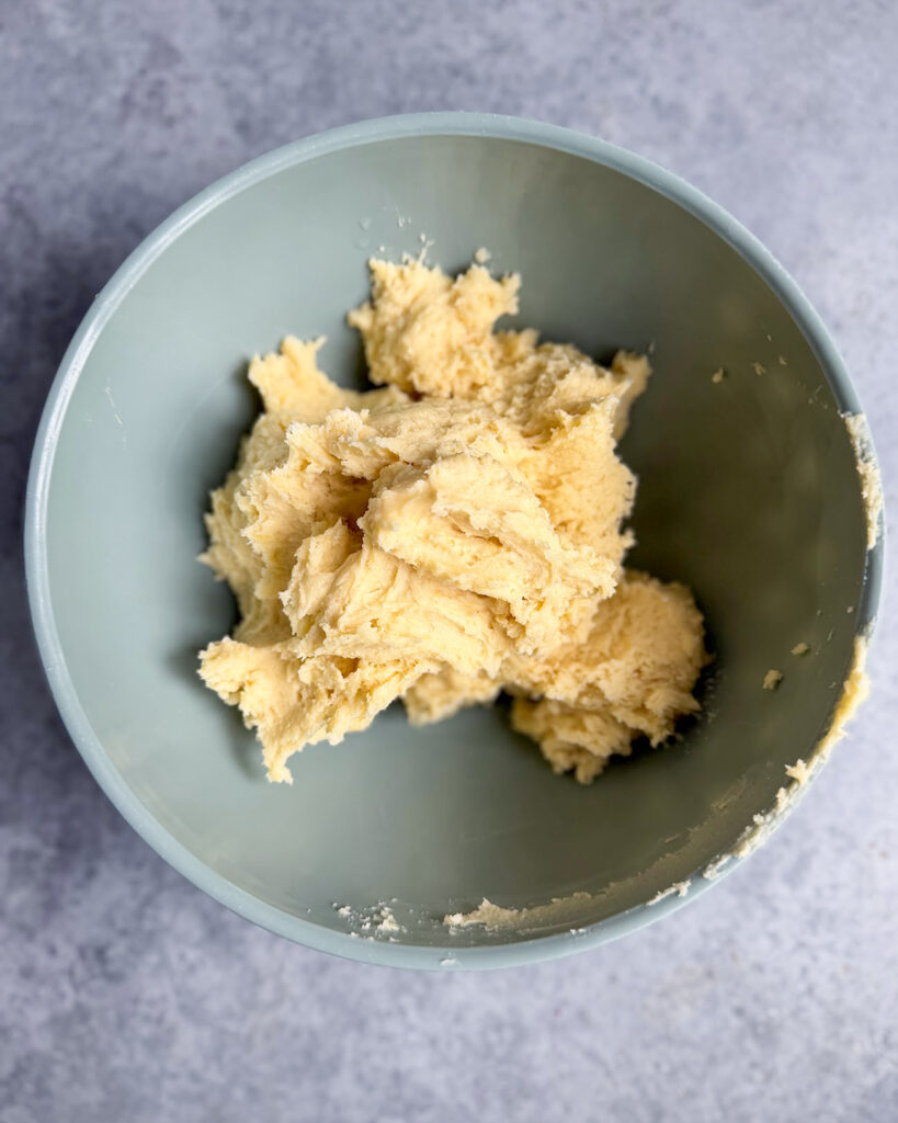 Lemon cookie dough in a bowl.