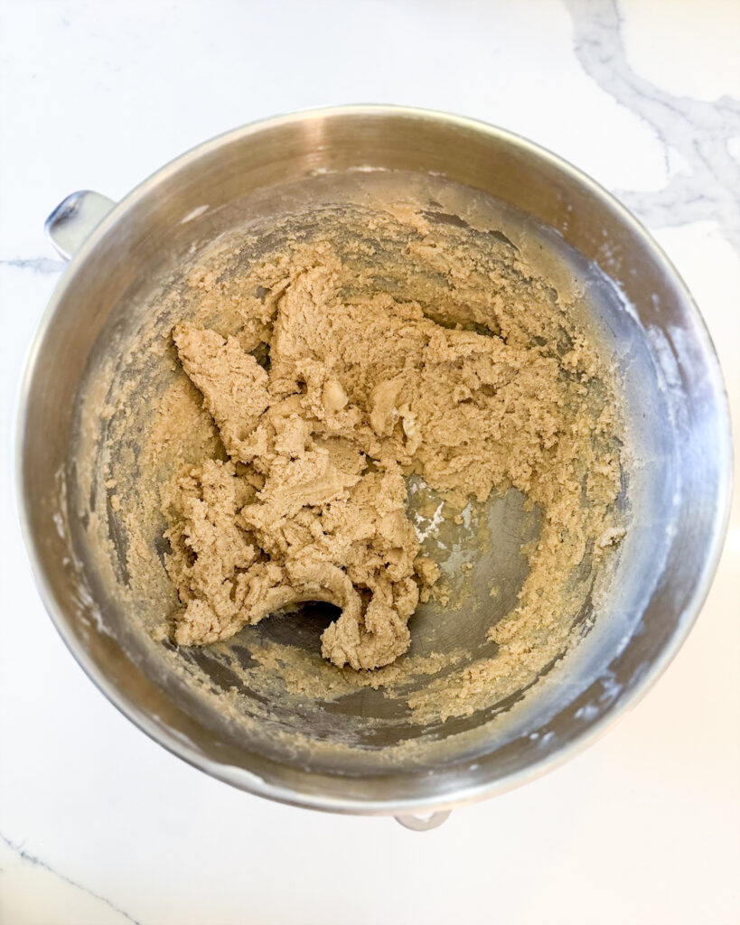 A bowl of chai shortbread cookie dough.