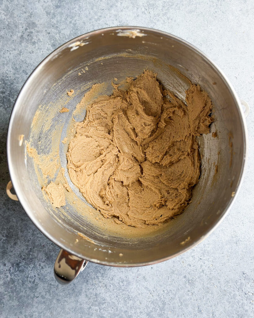 Creamed butter and brown sugar in a bowl.