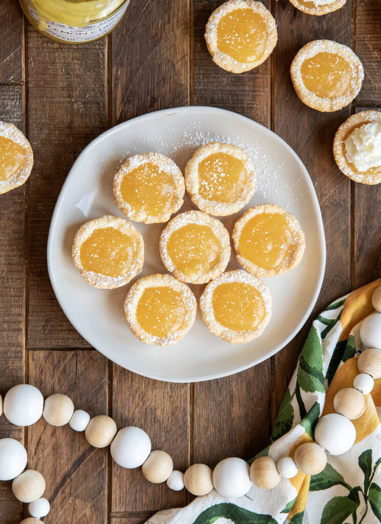 An above view of lemon tassies on a plate.