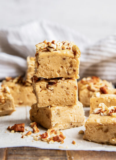 A stack of three pieces of penuche fudge.