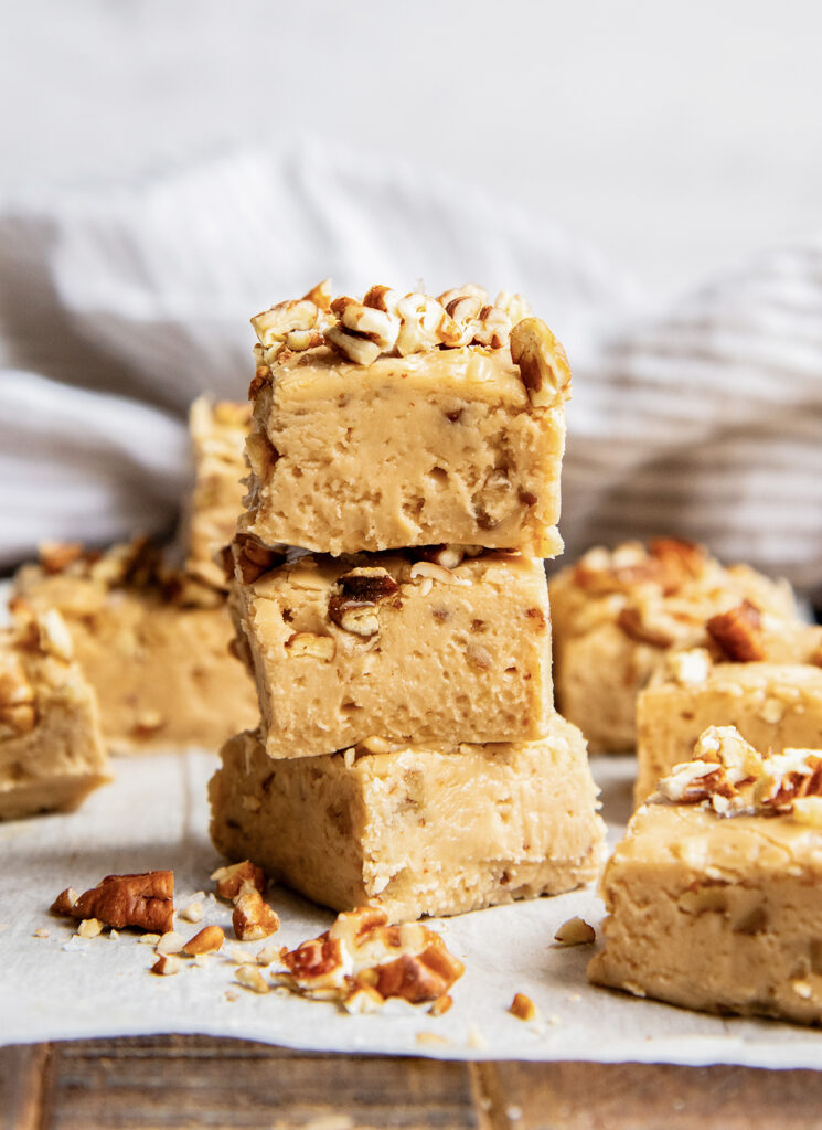A stack of three pieces of penuche fudge.