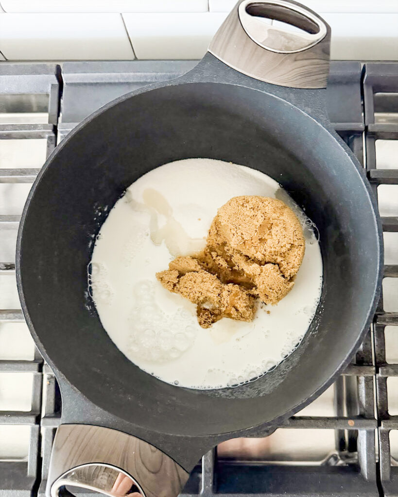 Brown sugar, sugar, and milk in a pot.