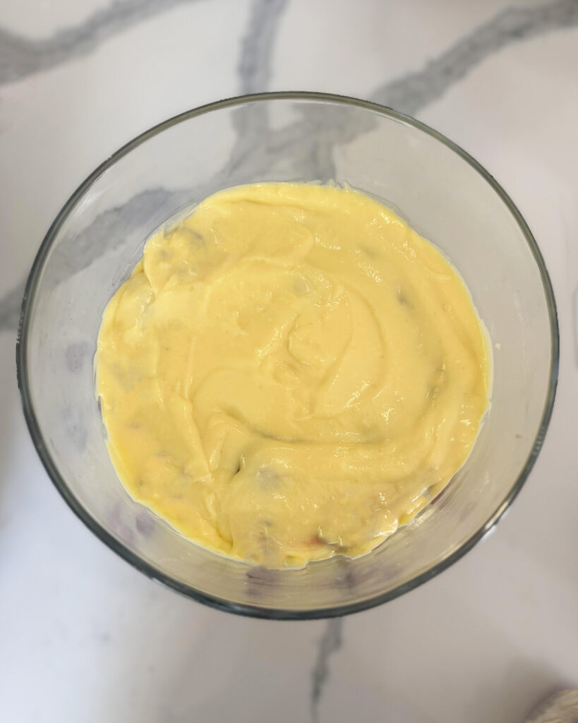 A glass bowl with vanilla custard.