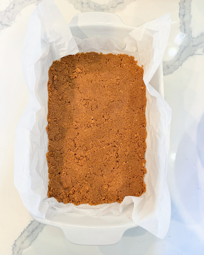 Gingersnap crust in a 9x13 pan.