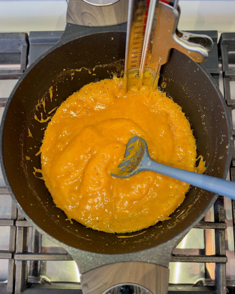 Caramel cooking in a pot.